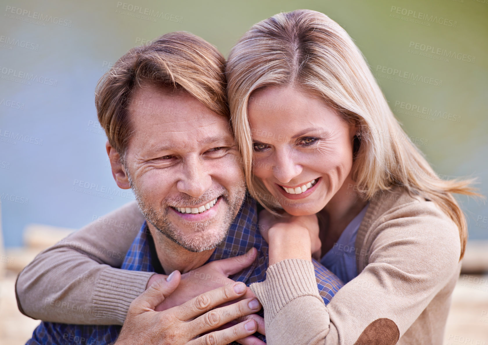 Buy stock photo A loving married couple enjoying a moment on the jetty at the lake