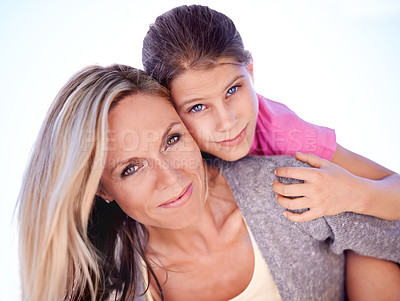 Buy stock photo Mother, daughter or portrait with piggyback in studio for bonding, support or hug on holiday with smile. Family, woman and girl child with face, happy or embrace with love or care on white background