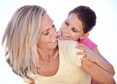 Buy stock photo Mother, daughter and happy with piggyback in studio for bonding, support and hug on holiday with relax. Family, woman and girl child with fun, smile and embrace with love or care on white background
