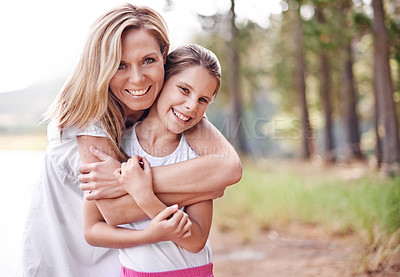 Buy stock photo Mother, daughter and portrait in forest with happiness for bonding, support and hug on holiday in nature. Family, woman and girl child with face, smile and embrace on vacation, travel and adventure
