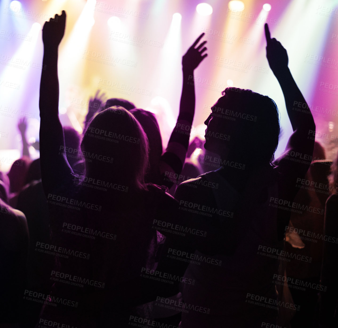 Buy stock photo Fans in silhouette at music festival, hands in air and neon lights with energy at live concert event. Dance, fun and group of excited people in arena at rock band performance or back of crowd at show
