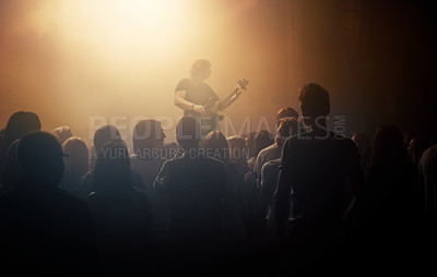 Buy stock photo Dark crowd, musician and people at a concert for a guitar performance, music festival and band. Event, show and an audience enjoying live night entertainment, performer or an artist at a club