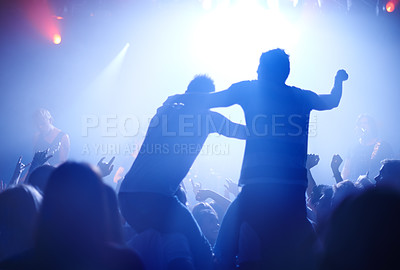 Buy stock photo Rock concert, celebration and party crowd with lighting and people back with dancing. Silhouette, audience and night festival event with performance and group listening and watching a band music