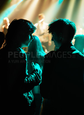 Buy stock photo Neon, friends and fans at music festival, lights and crowd in silhouette at live band performance on stage. Happiness, excited people and discussion with lighting, excitement at rock concert together