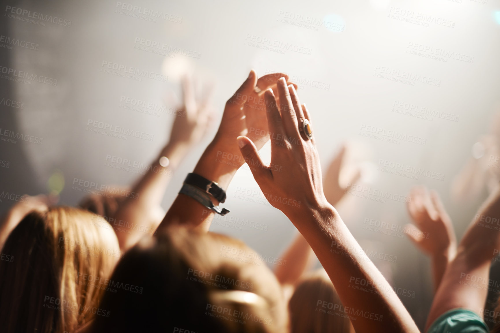 Buy stock photo Clapping crowd, party and people at a concert for celebration, performance and watching a band. Energy, audience support and fans applause at a music festival, club or dancing rave show at night