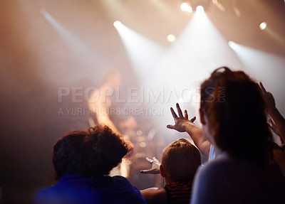 Buy stock photo Hands, lighting and excited fans at music festival, crowd watching live band performance with musician on stage. Happiness, excitement and audience in arena, woman fans with hand out at rock concert.