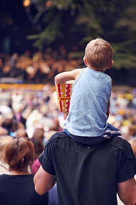 Buy stock photo Back, festival and a boy sitting on dad shoulders outdoor at a music concert together for bonding or entertainment. Family, kids and crowd with a father carrying his child son outside at an event