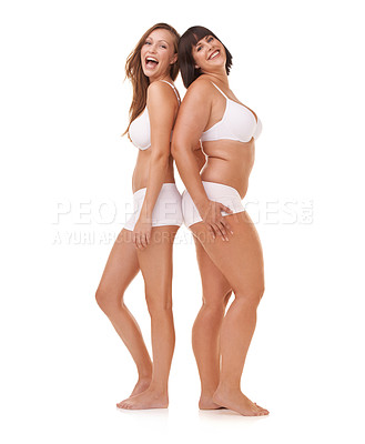 Buy stock photo Two women of different body shapes standing together back to back while isolated on white