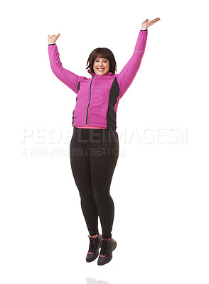Buy stock photo Portrait, smile and jump with woman winner in studio isolated on white background for celebration. Success, energy and motivation with confident young person in exercise outfit for health or wellness