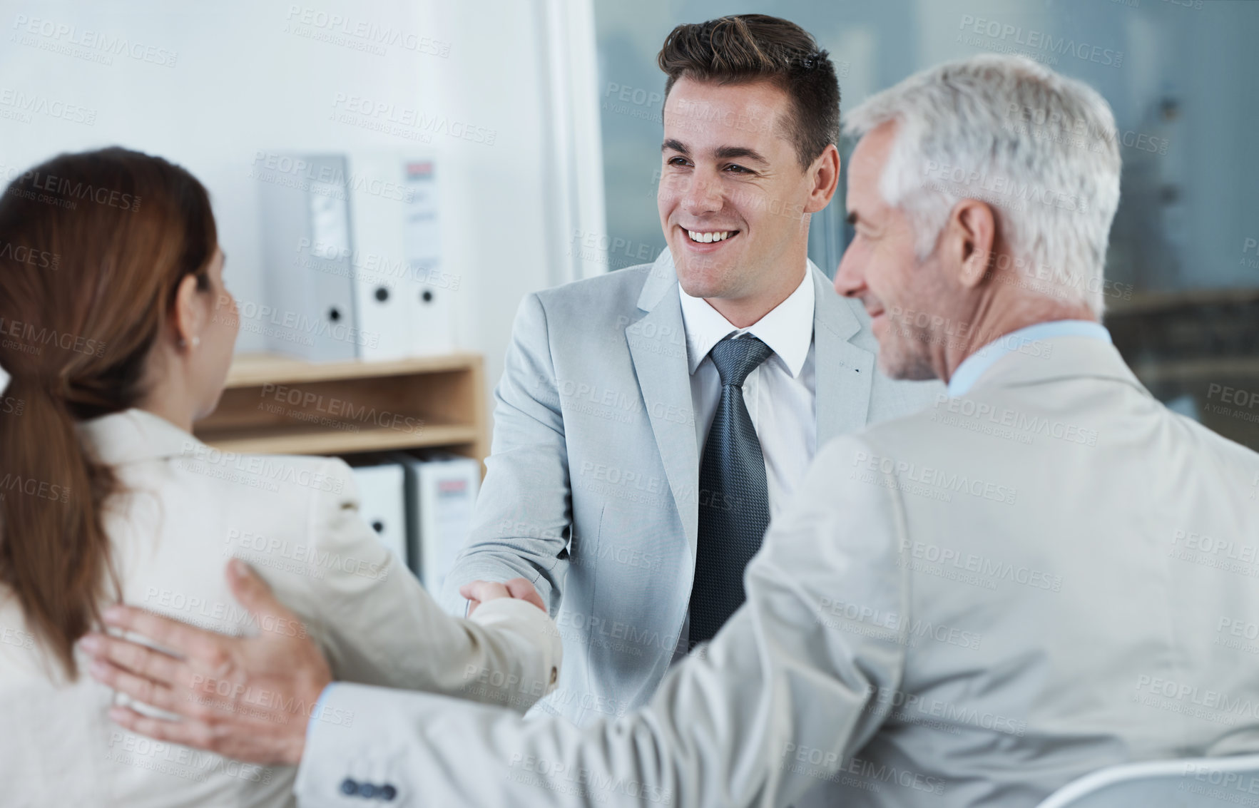 Buy stock photo Meeting, welcome and handshake with business people in human resources interview for recruitment. Thank you, hiring or onboarding with corporate man and woman shaking hands for contract agreement