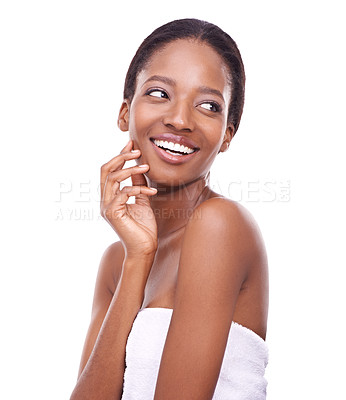 Buy stock photo A beautiful woman wearing a towel and touching her face