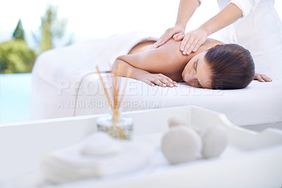 Buy stock photo Cropped shot of an attractive young woman enjoying a relaxing massage