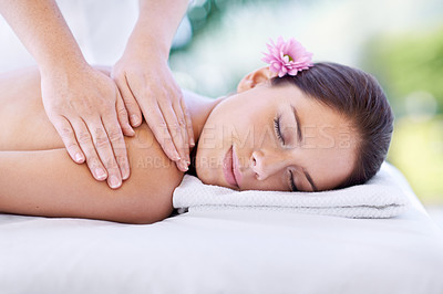 Buy stock photo Cropped shot of an attractive young woman enjoying a relaxing massage