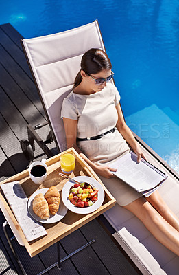 Buy stock photo Breakfast, documents and business woman poolside, reading information on work trip from above. Food, paper and woman employee sitting outdoor at hotel swimming pool for contract review or hospitality
