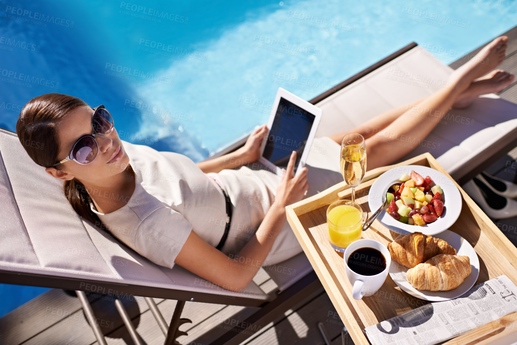 Buy stock photo Hotel, pool and woman with breakfast, tablet and relax on business trip for food or drink service. Travel, hospitality and businesswoman on lounge chair at brunch with summer, luxury or villa holiday