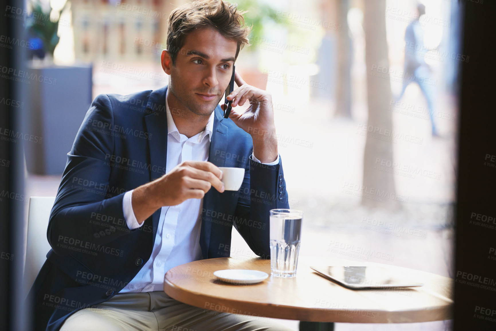 Buy stock photo Phone call, coffee and business man at cafe outdoor for communication, networking or discussion. Mobile, espresso and confident young corporate employee at restaurant table for remote work in city