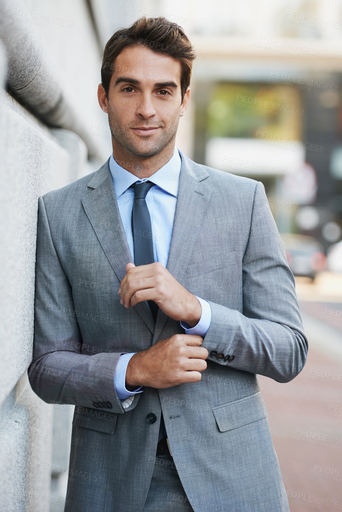 Buy stock photo A handsome young businessman looking at the camera