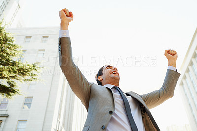 Buy stock photo Smile, success and hands raised with businessman in city for celebration of bonus or promotion. Corporate, building and sky with happy employee cheering outdoor in urban town for target or goals