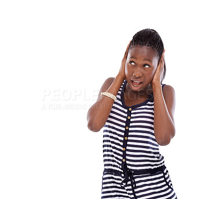 Buy stock photo Shot of a young girl covering her ears while looking up in disbelief