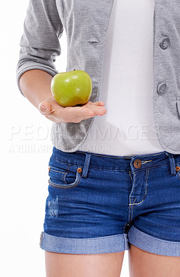 Buy stock photo Body, apple or hand of woman with a healthy choice for digestion isolated on white background. Nutrition vitamins, closeup or person in studio with fruit or offer for fiber, detox diet or wellness