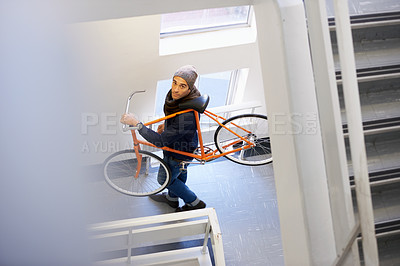 Buy stock photo Bicycle, stairs and man in a building carrying bike for healthy and eco friendly transportation for travel. Staircase, carry and cyclist with apartment complex, take up and journey of walking steps