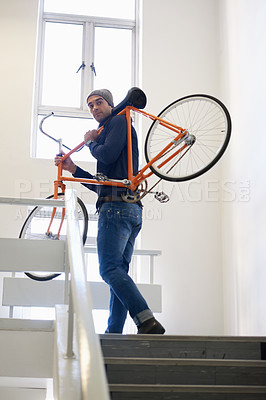 Buy stock photo Bicycle, stairs and man carrying bike for green and eco friendly transportation for travel. Staircase, carry and cyclist with apartment complex, take up and journey of walking steps in building