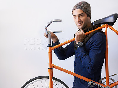 Buy stock photo Portrait, smile and man with a bicycle, hipster and confident guy with mockup space and cyclist. Face, person and model with a bike and fashion with casual outfit and sustainability with transport