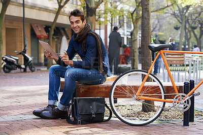 Buy stock photo Portrait, city and smile with man, tablet and bicycle with adventure and travel with internet and social media. Person, outdoor and New York with guy and technology with connection and meme with app