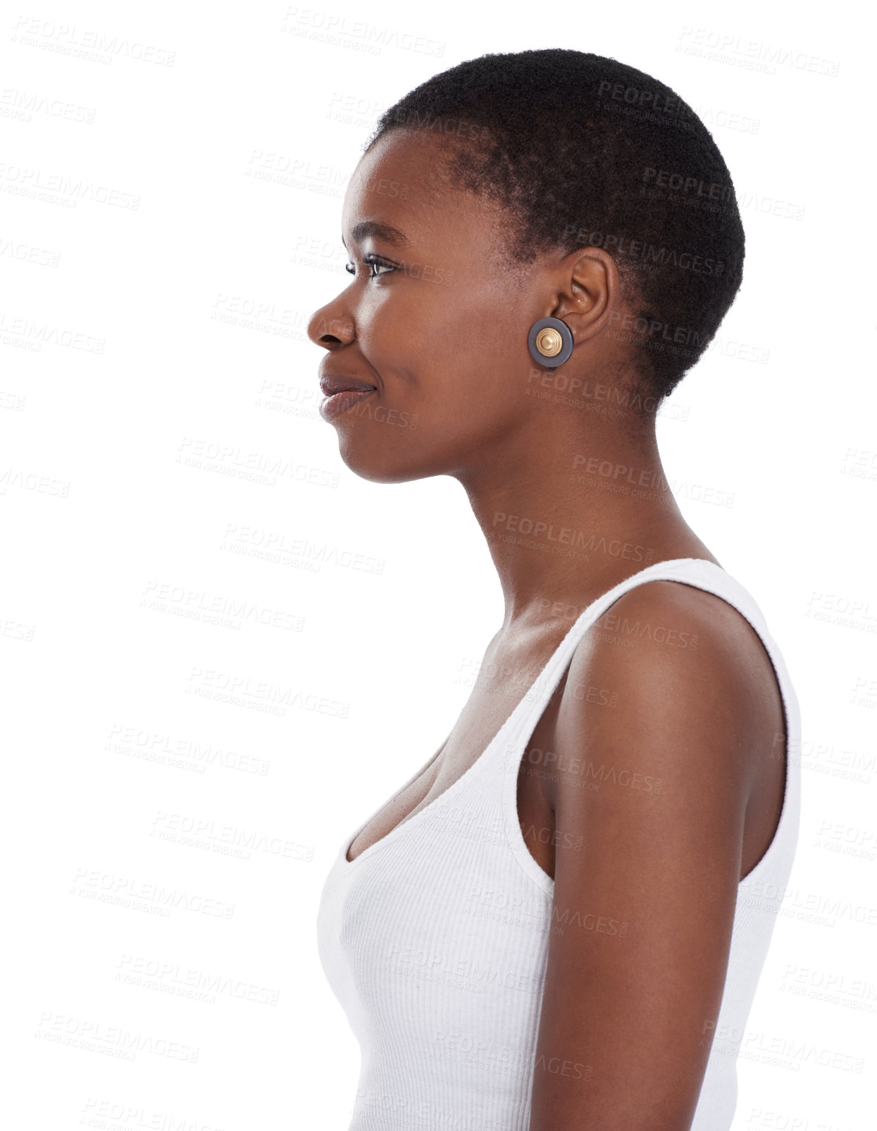 Buy stock photo Profile shot of a smiling young woman standing against a white background