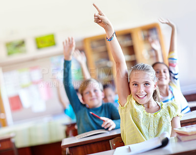 Buy stock photo Question, students and hand raised in portrait for knowledge in classroom, solution and children at school. Pupils, smile and curious for answer or information, learning and studying or education