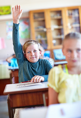 Buy stock photo Question, student and hand raised for information in classroom, solution and boy at school. Male person, asking and curious for answer on curriculum, learning and studying or education for growth