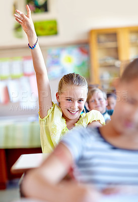 Buy stock photo Question, student and hand raised for solution in classroom, interest and girl at school. Female person, smiling and curious for answer or information, learning and studying or education for growth