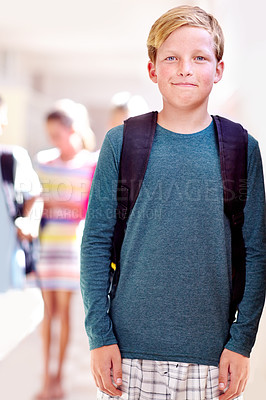 Buy stock photo Student, portrait and boy with kids in hallway with education, study and backpack for back to school. Youth, young kid and learning on campus with children and happy from class and confidence
