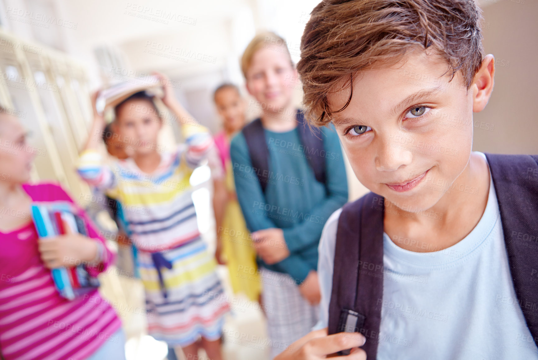 Buy stock photo Students, portrait and boy with smile in hallway with education, study or backpack for back to school. Youth, young kid and learning with friends on campus with children and happy after class and fun
