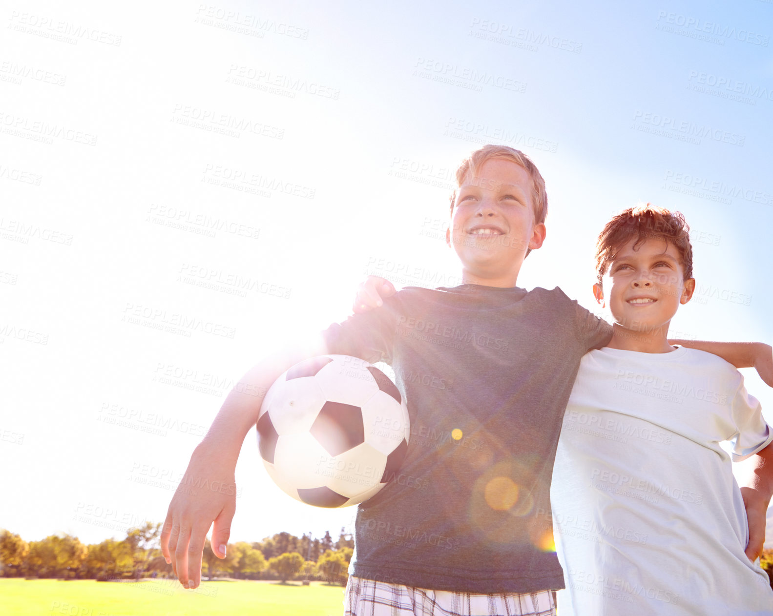 Buy stock photo Soccer, friends and hug for unity on field, support and solidarity for sports game on grass. Happy boys, children and embrace on outdoor pitch, bonding and pride for collaboration in challenge