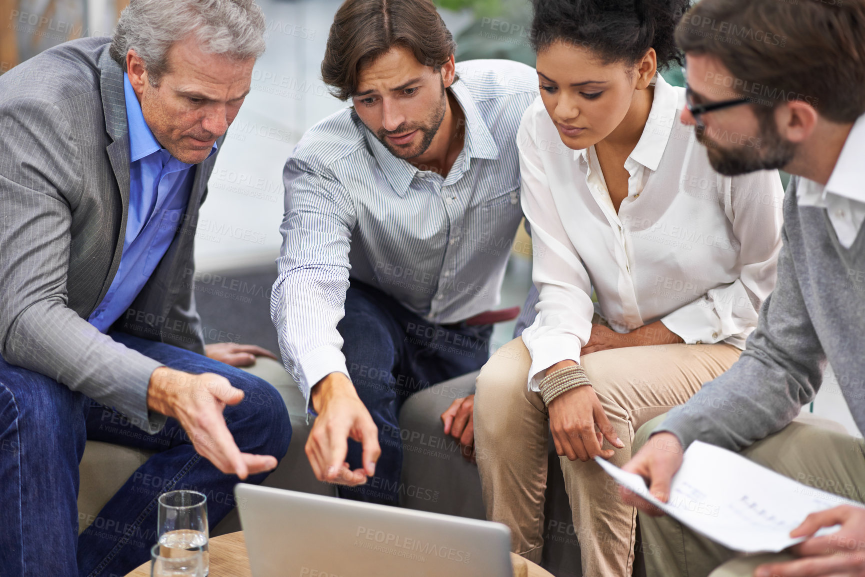 Buy stock photo Business people, laptop and meeting with team for planning, strategy or brainstorming at office. Group of employees on computer with documents for discussion, research and development at workplace