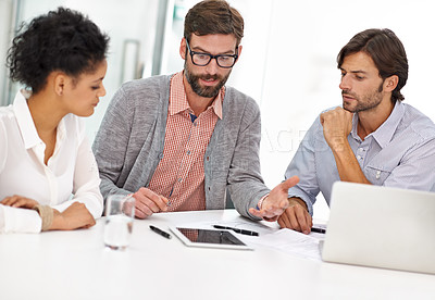 Buy stock photo Creative people, tablet and meeting with team in planning or discussion for online research on table at office. Group of employees with technology for project, brainstorming or startup at workplace