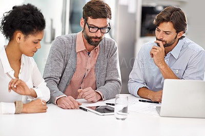 Buy stock photo Creative people, tablet and thinking in meeting for teamwork, planning or online research on table at office. Group of employees in wonder with technology for project plan or startup at workplace