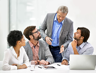 Buy stock photo Shot of a group of a diverse group of business professionals having a meeting