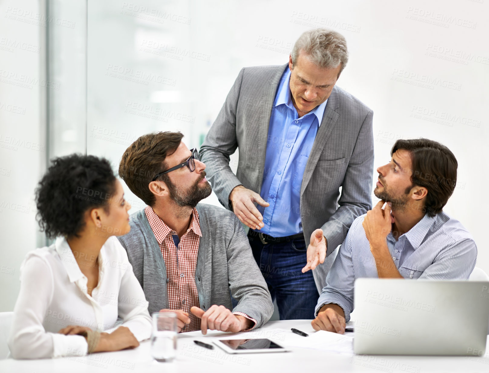 Buy stock photo Shot of a group of a diverse group of business professionals having a meeting