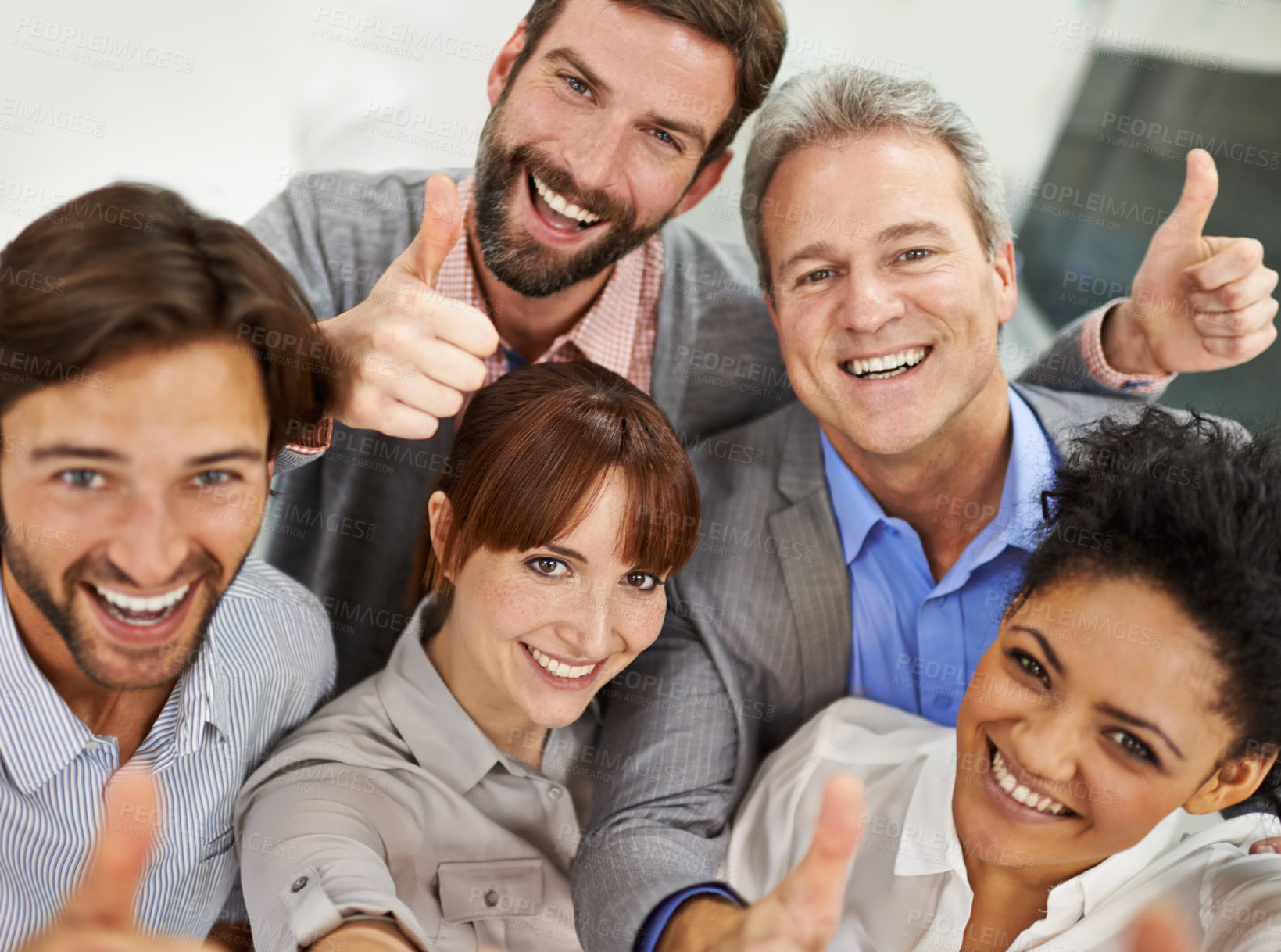 Buy stock photo Portrait of a group of businesspeople giving the thumbs up to the camera