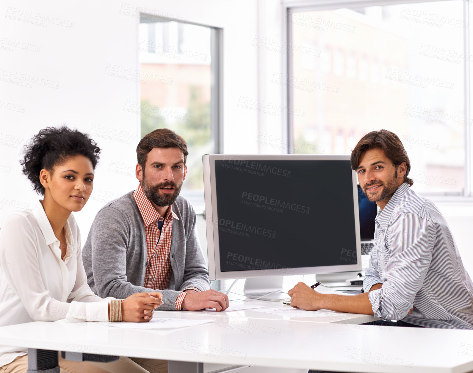 Buy stock photo Portrait of a diverse group of businesspeople sitting in an office