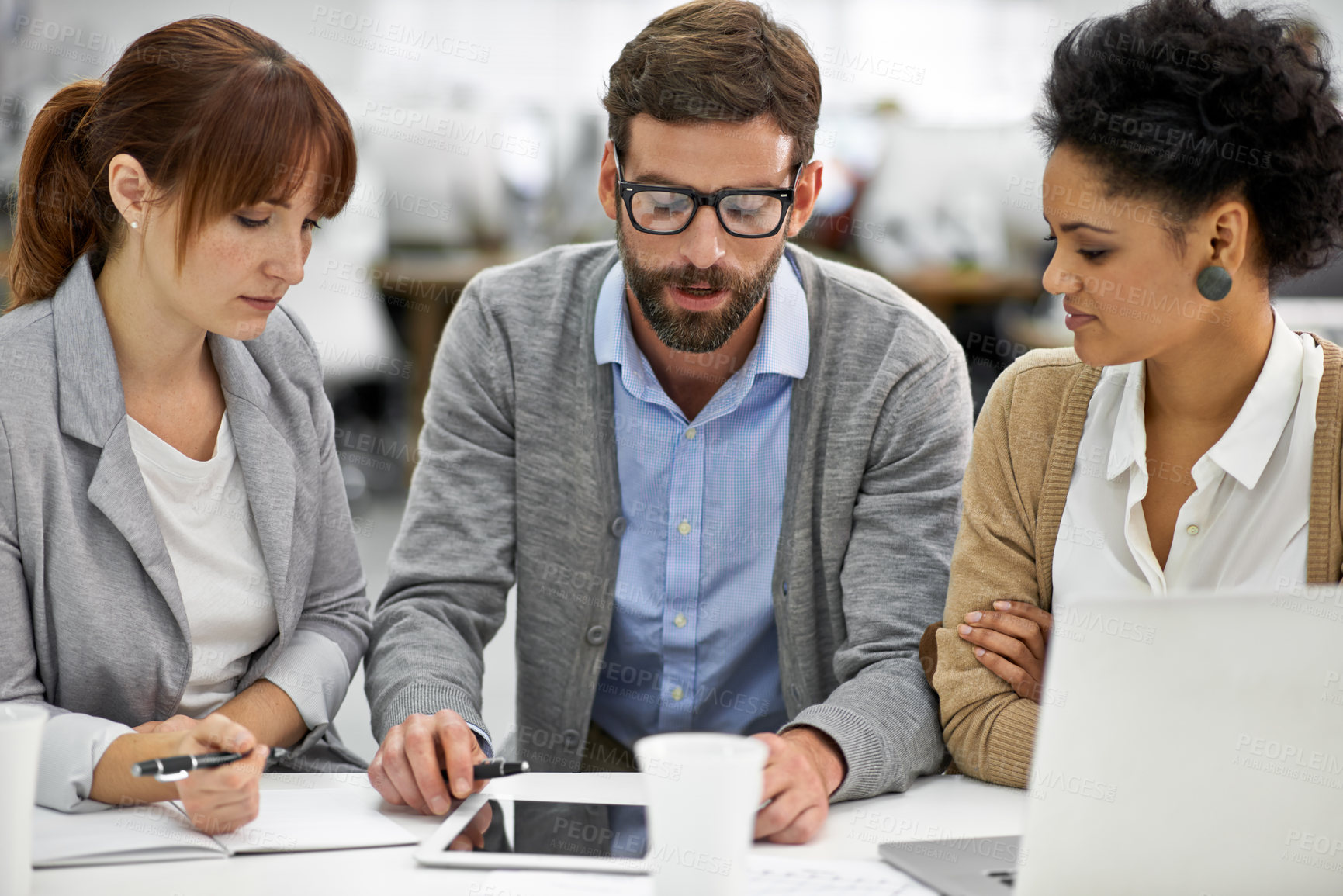 Buy stock photo Businessman, tablet and meeting with team in research, planning or brainstorming at office. Business people, group or employees with technology or notebook in project plan or development at workplace