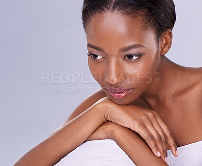 Buy stock photo Beauty, skincare and thinking, portrait of black woman with glowing skin, care and natural spa makeup in studio. Relax, dermatology or luxury cosmetics with face of girl isolated on purple background