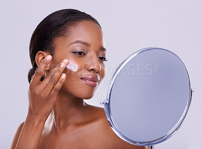 Buy stock photo Mirror, cream and black woman for beauty and dermatology, cosmetic product and shine on white background. Skincare, lotion or sunscreen for moisturizer, antiaging with skin and facial in studio