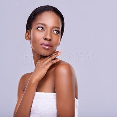 Buy stock photo Cropped shot of a beautiful young woman against a purple background
