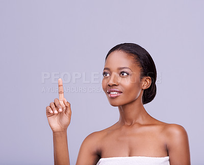 Buy stock photo Beauty, finger and interface with black woman user in studio isolated on purple background for skincare menu. Skincare, access or touchscreen technology and customer at spa to select treatment option