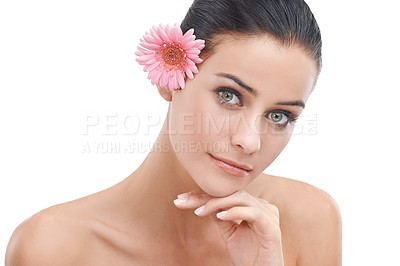 Buy stock photo Woman, portrait and flower for skincare in studio with beauty, floral cosmetics or dermatology. Face of a young model or person with pink daisy for makeup with creative or scent on a white background