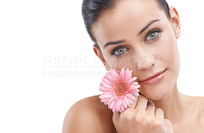 Buy stock photo Woman, portrait and flower for beauty in studio with skincare, floral cosmetics or dermatology. Face of a young model or person with pink daisy for makeup with creative or scent on a white background