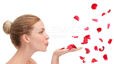 Buy stock photo Woman, studio and blow with rose petals in profile for natural beauty, skincare or wellness by white background. Girl, model or person with flowers for celebration, organic confetti or Valentines Day
